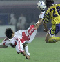 Le spectaculaire attaquant chinois Fan Zhiyi tente une bicyclette - AFP - Frederic J. Brown